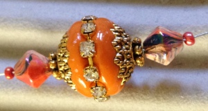 Orange segement with rhinestone bead