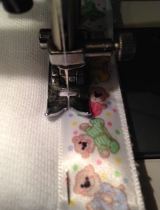 Pin and sew ribbon to edge